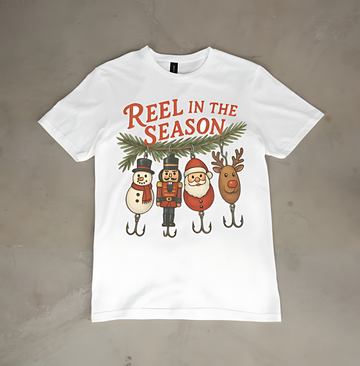 Reel in the Season Christmas T-Shirt – Funny Holiday Fishing Graphic Tee with Santa, Reindeer & Snowman
